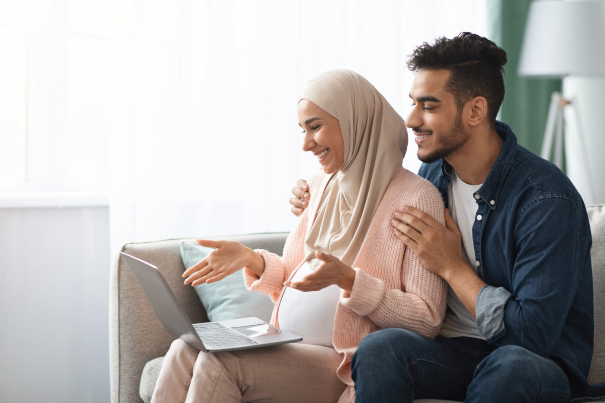 Pregnant Islamic woman and her husband attending a virtual baby shower