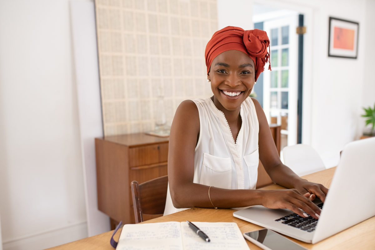 Black woman looking fover her virtual event sponsorship agreement.